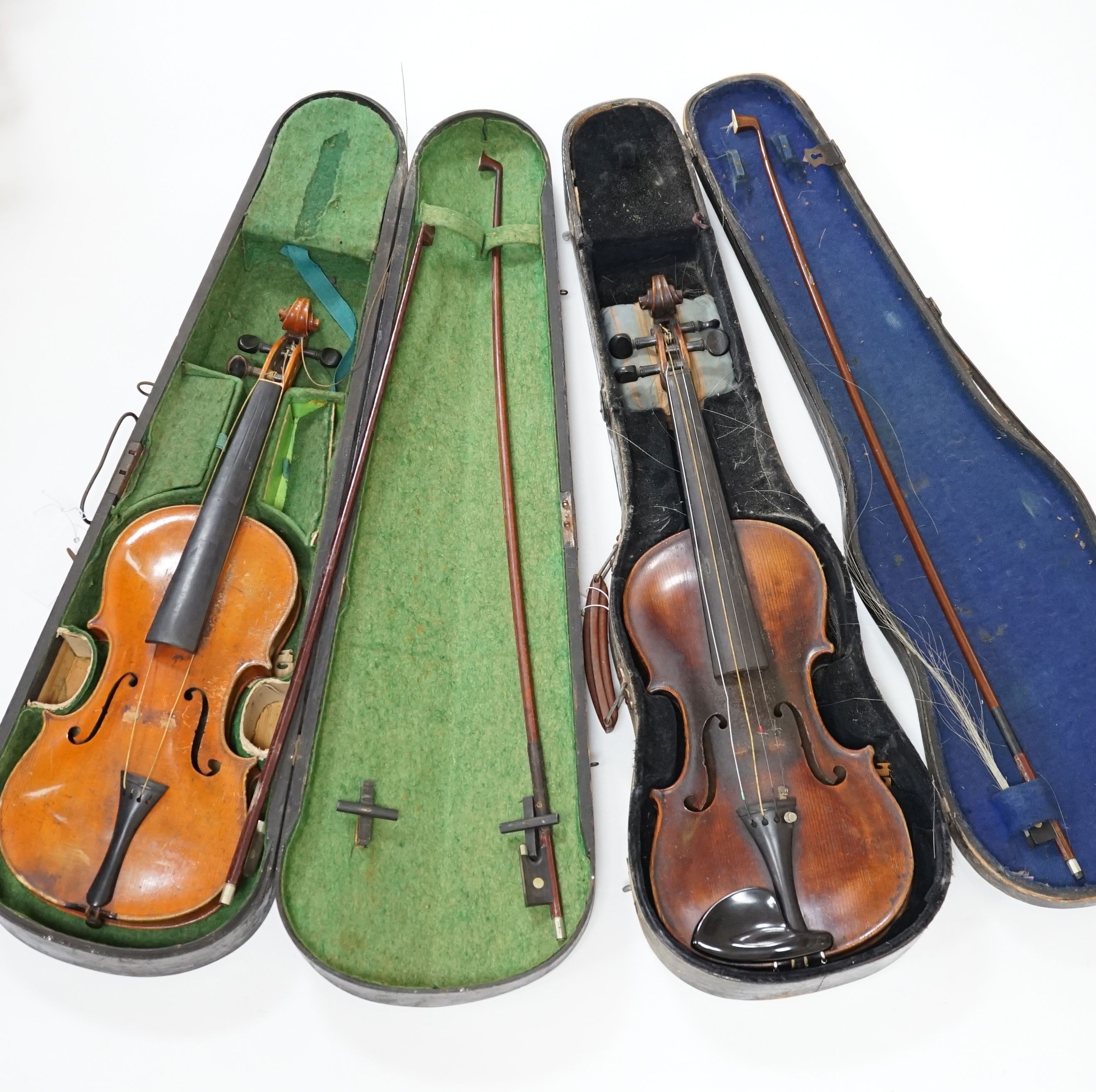 A 19th century 3/4 size violin, cased with 2 bows and 1 other German violin